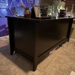 Executive style office desk.  Dark wood. 2 drawers on each side. Slide out keyboard drawer.  $225