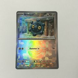 Bronzor (Master Ball) 066/131 Sv: Prismatic Evolutions Reverse Holo Pokemon M NM