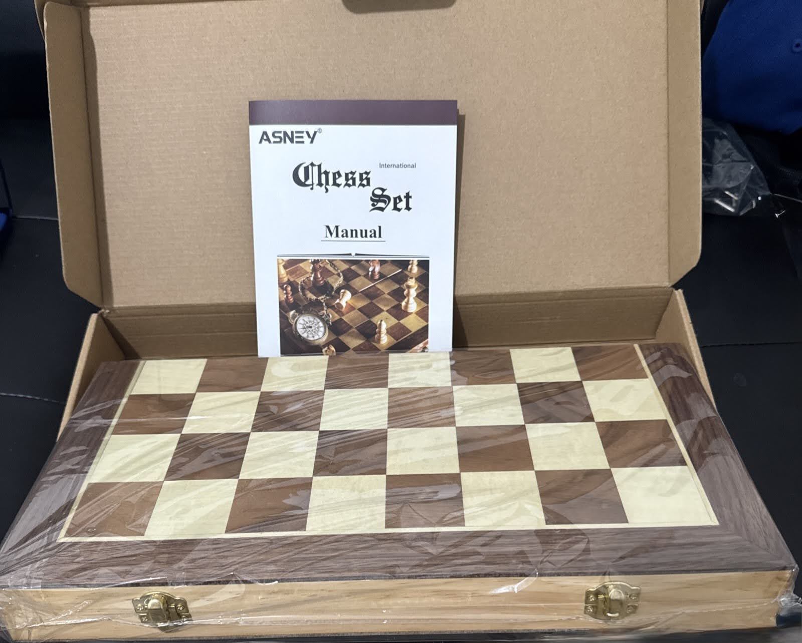 The Asney Artisan Carved Wooden Folding Chess set is a high-quality, handmade chess set made from brown wood.