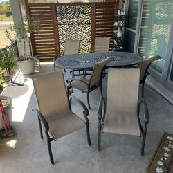 Heavy Wrought iron table Plus 6 Chairs. 