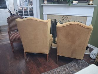 Two wingback chairs for sale