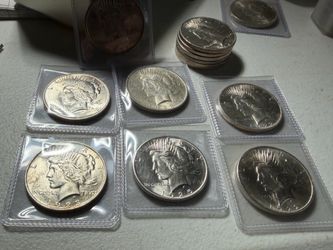 Uncirculated silver peace  dollars mixed years silver US coins
