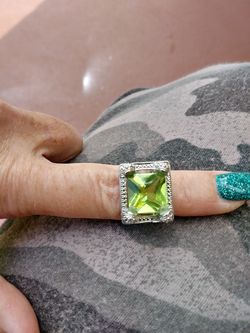 Brand new size 6 genuine stamped 925 sterling silver with lime green crystal stone