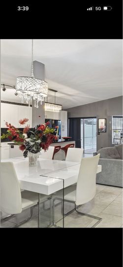 Glass legs dining table with 8 chairs