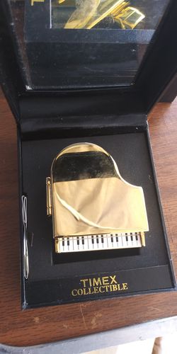 A,TIMEX COLLECTIBLE PIANO CLOCK