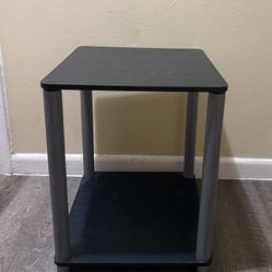 Black Side Table Compact black side table with metal legs. 20"x16"