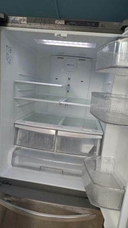 Pull out freezer with side by side fridge.