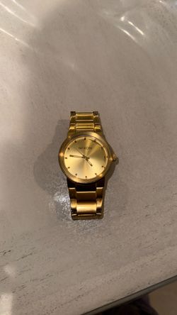 Gold Nixon watch