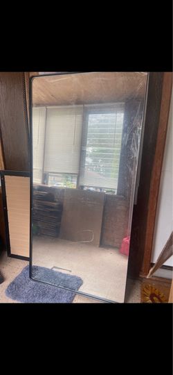 Mirror with metal frame