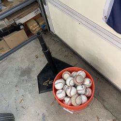 Bucket Of Baseballs And Batting Tee