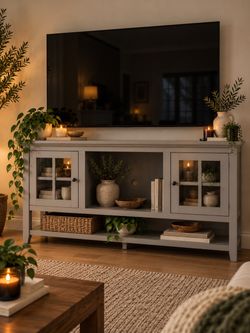 Tv Stand Upper and Lower storage 54” wide, 32” tall and has adjustable shelving and tempered-glass doors.