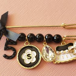 Brooch With Tassels Black And White With Gold Pin