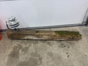 High voltage insulator and wooden cross arm