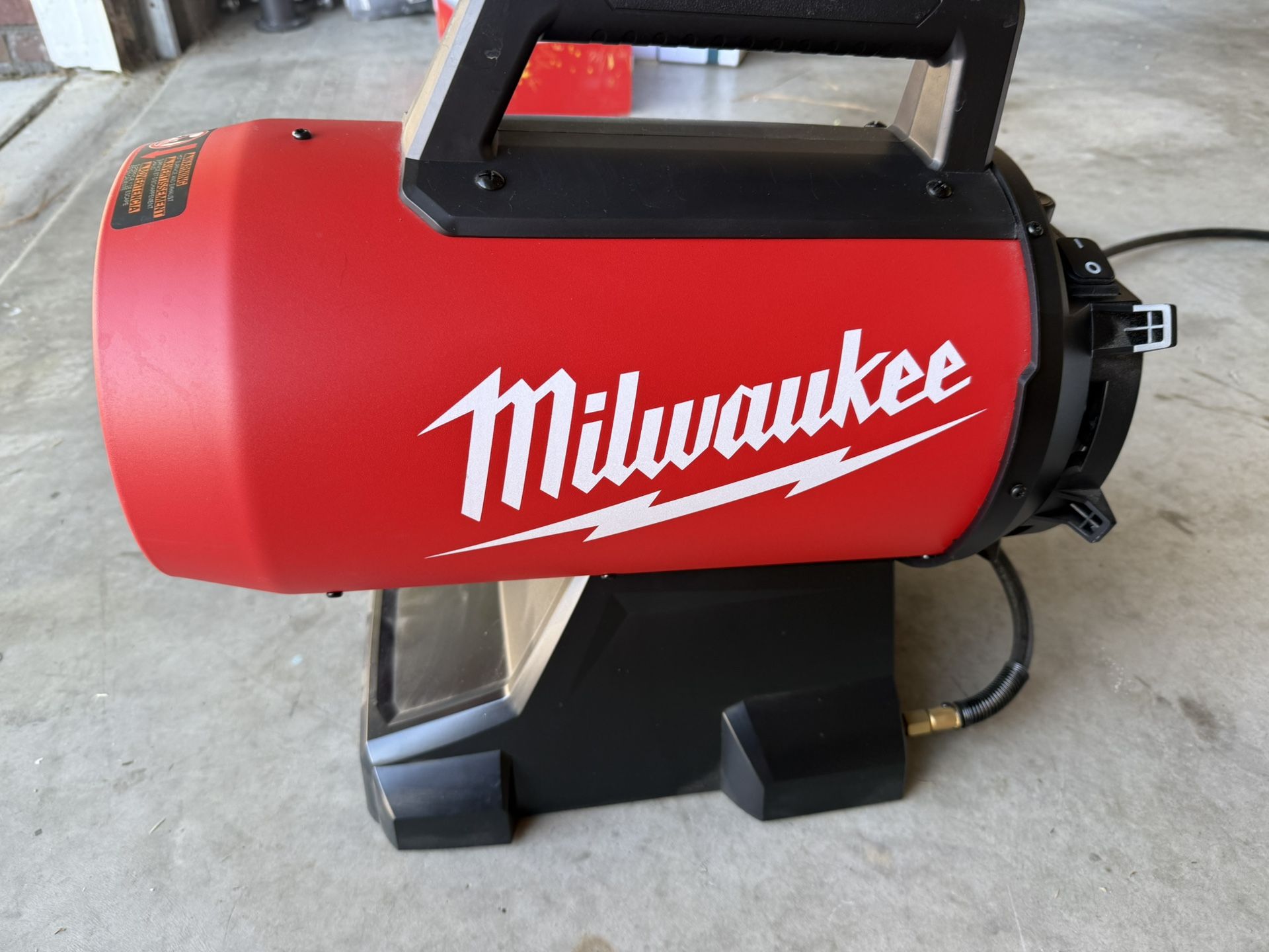 Milwaukee propane heater with fuel tank &battery ready to ignite