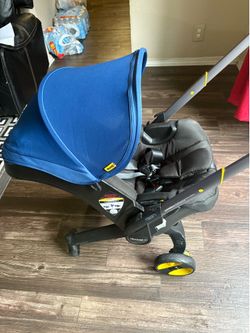 Doona Car Seat stroller + base all in one car seat with extra car seat cover