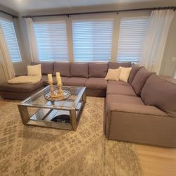 Grey sectional couch with chaise lounge.