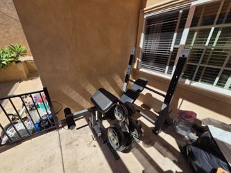Bench set with bar, and weights 245lbs with rack
