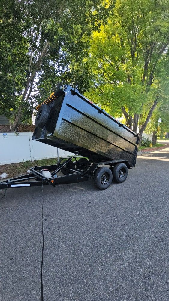 BRAND NEW DUMP TRAILER 12x8x4 12,000 LBS HYDRAULIC SYSTEM ROLLING TARP AND SPARE TIRE LED LIGHTS TITLE IN HAND READY FOR WORK FOR ANY QUESTION TEXT ME