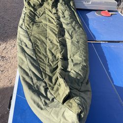 Intermediate, cold-weather, sleeping bag with hood