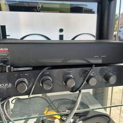 Vintage audio setup featuring an Acurus L10 Line Preamplifier stacked below an Adcom ACE-515 AC Enhancer