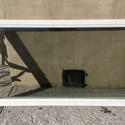 White Dual pane solid framed window, 33x61.5in