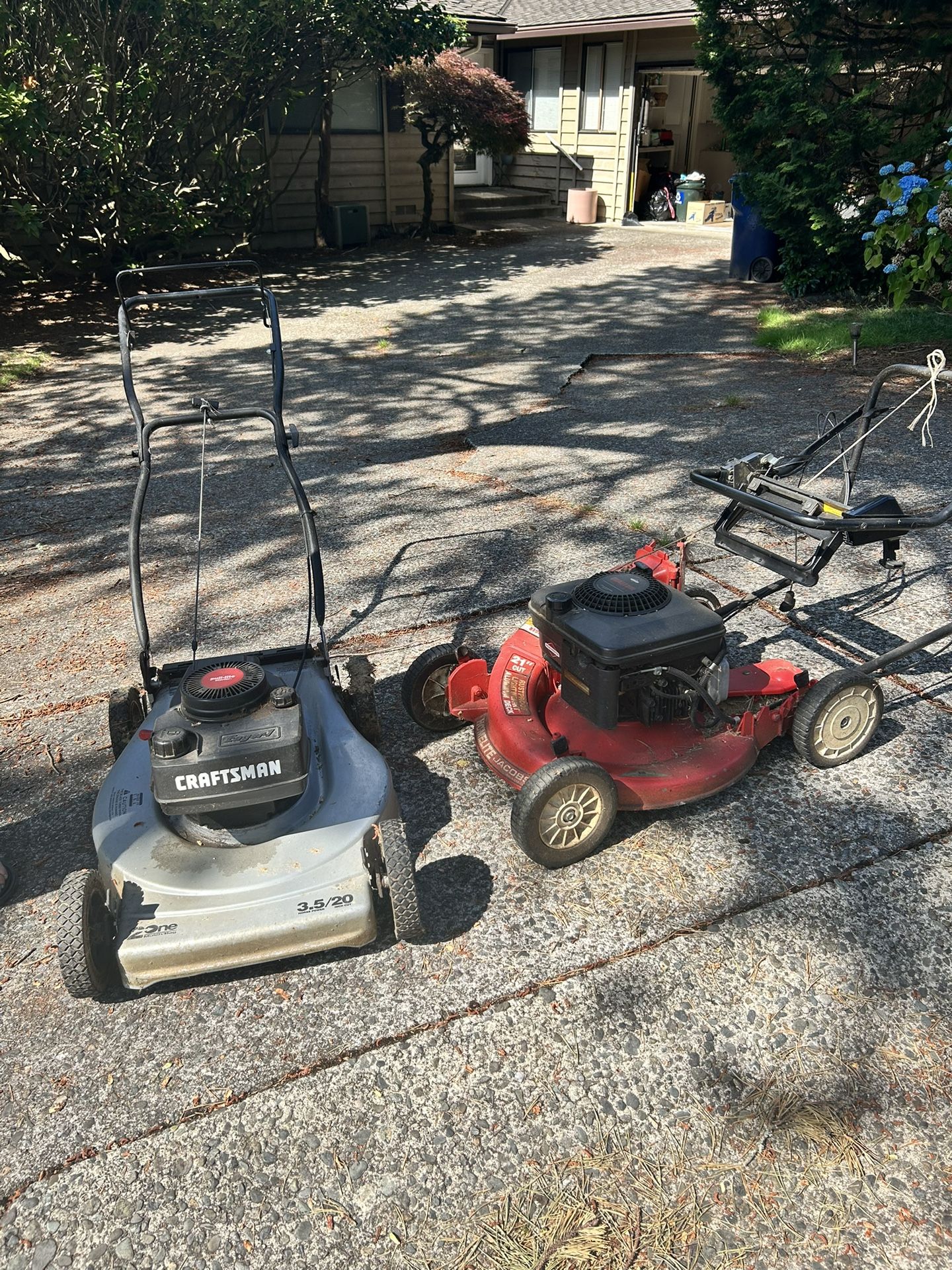 Two Small Engine lawn mowers
