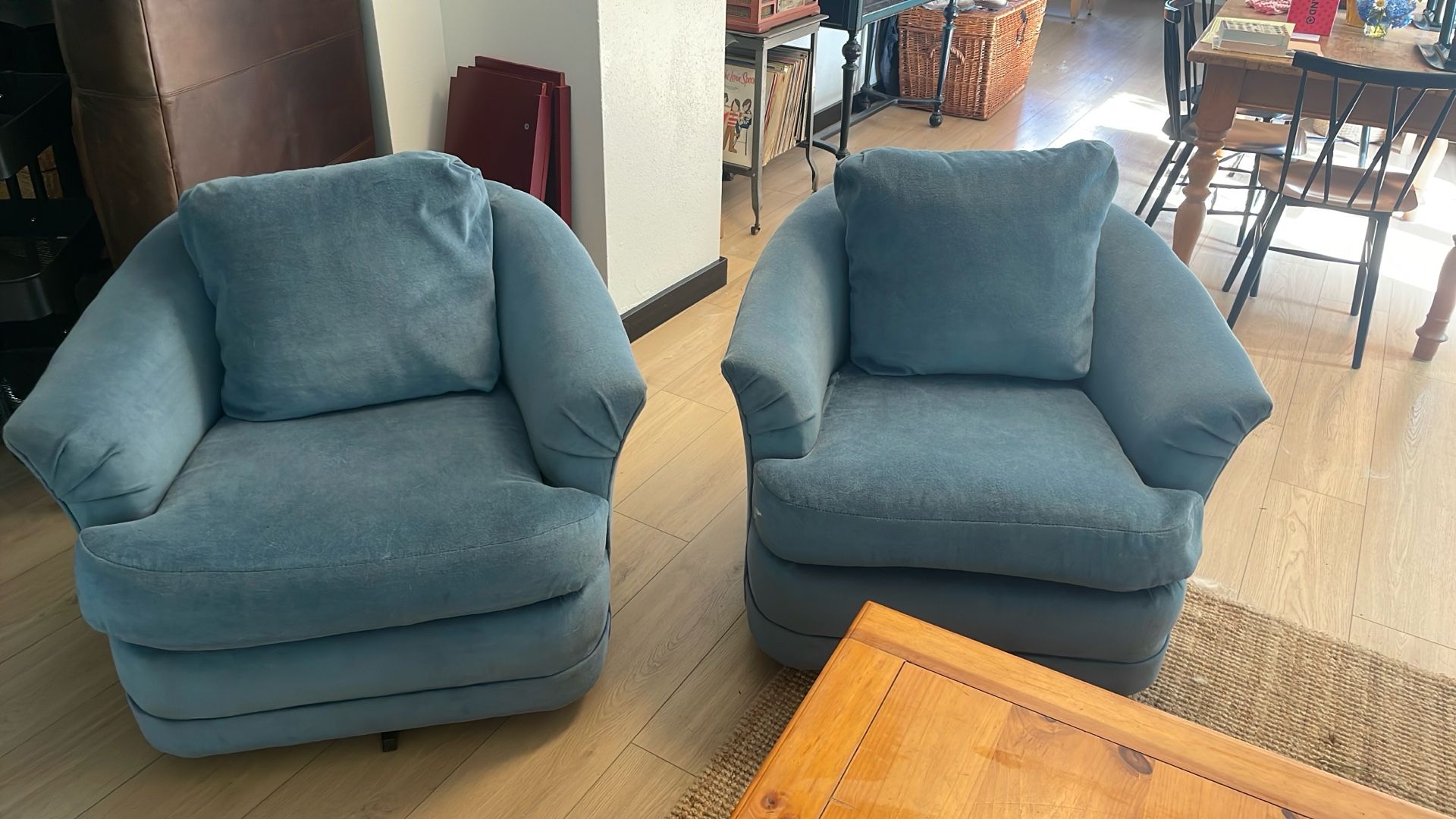 Two Blue Swivel Barrel Chairs