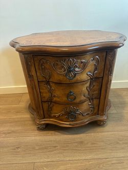 Ornate Wood Cabinet with Three Drawers