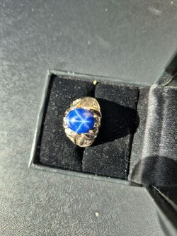 Mens Custom 18k rolled over 14k white gold with a 4ct. Flawless Star Sapphire surrounded by 1 1/4 ct. Diamonds. One of a kind