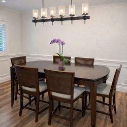 Beautiful solid wood dining table set with 6 chairs.