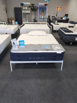 Full size mattress and white metal frame