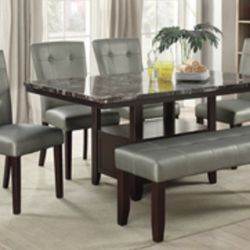 Beautiful Dining Set. Four chairs and a bench with storage 