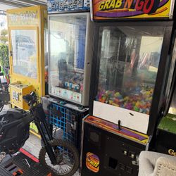 Arcade Games Two Claw Machines And One Stacker Money Exchange Games