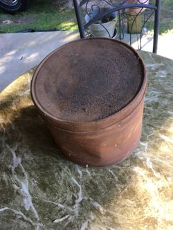 Old metal can full of old nails
