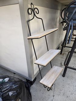 Wrought iron shelves.