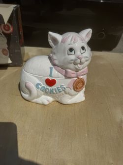 I Love Cookies" kitten cookie jar features a white cat wearing a pink apron and measures approximately 10.6 inches tall
