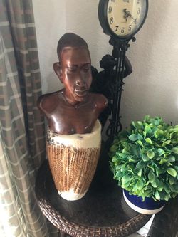 Drum and wooden bust