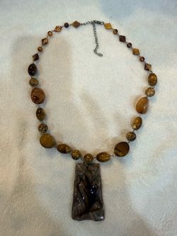 vintage EsMor statement necklace featuring earth-toned tiger's eye, stone, and marbled resin or glass beads complete with a large geometric focal pend