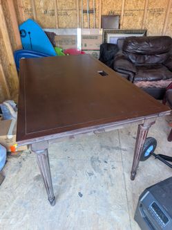 Large wooden desk with glass top