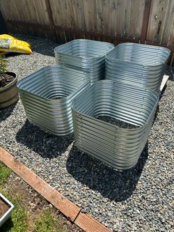 2 sets of four! Raised garden beds, one set of four assembled one set of four still in box