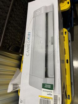A modern black clamshell-style commercial heat press machine for garments.