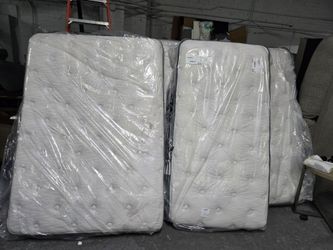 Tufted Mattresses in Plastic Wrap