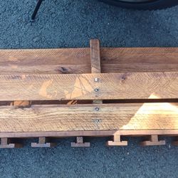 A CUSTOM MADE WINE RACK WITH WINE GLASSES HOLDERS