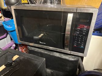 Like new barely used 1.6 cu. ft. Countertop Microwave in Stainless steel with Gray Cavity