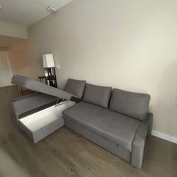 Sofa bed with chaise and storage compartment. IKEA FRIHETEN.