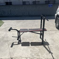 Adjustable weight bench W rack and leg extension