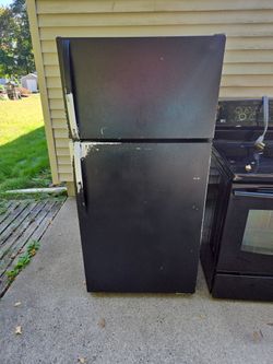 Electric Stove And Refrigerator Both Working Fine Upgraded Them Stove Is an LG  Fridge Unknown Took Off Insignia And Painted It Black 