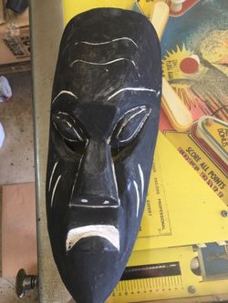 This is an antique hand carved wood mask