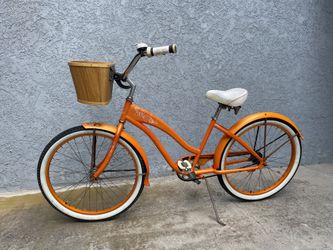 Orange bike with basket sale