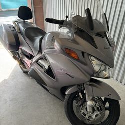 ST1(contact info removed) Silver Honda Motorcycle 